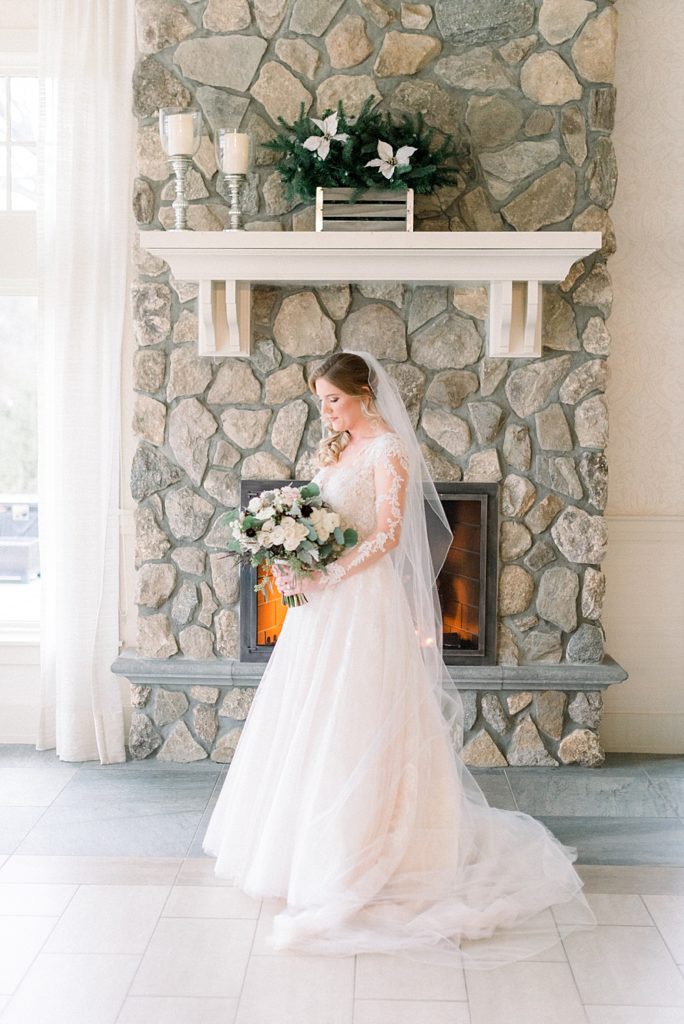bride in front of fireplace