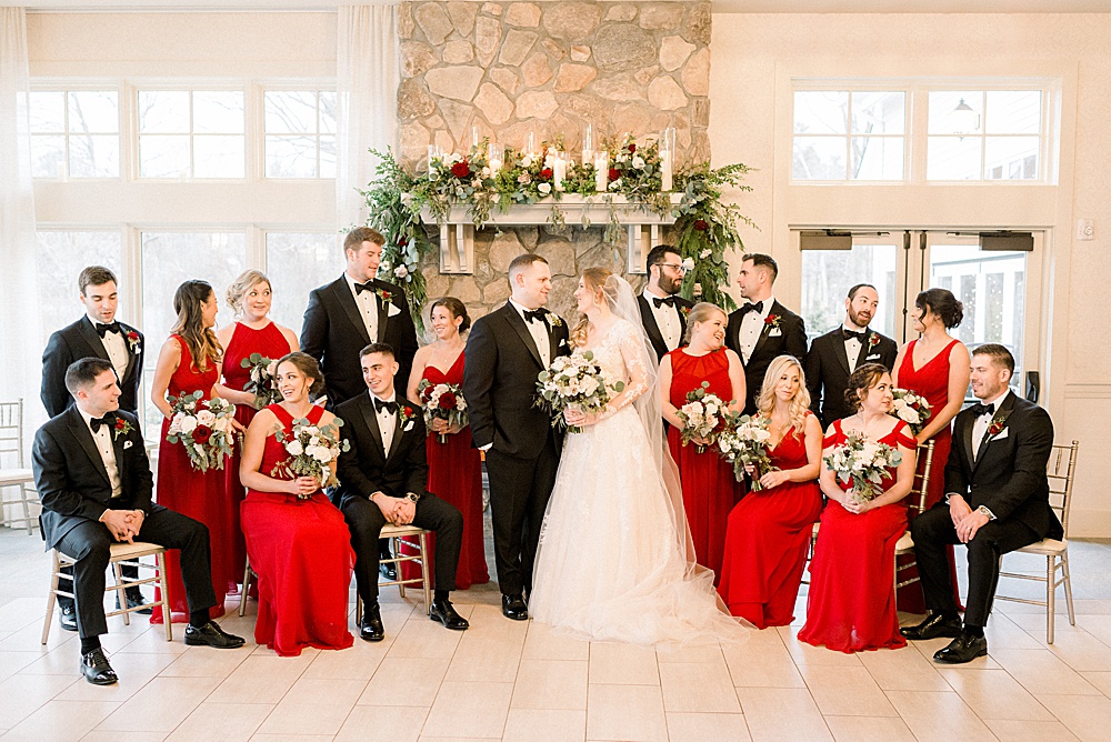 bridal party in front of fireplace